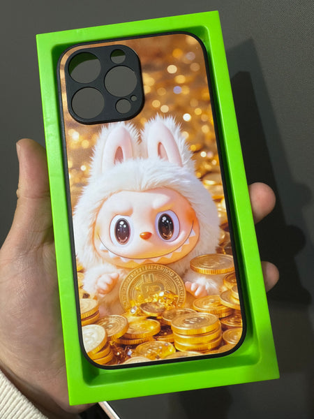 Custom phone case featuring a ;labubu character holding gold coins in a green SnapShell tray